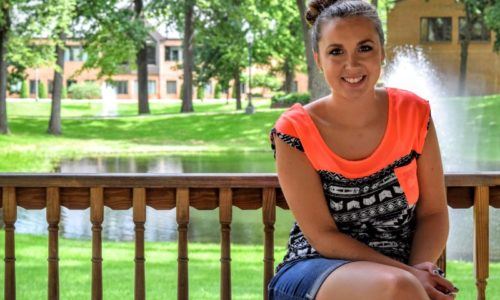 Bethany sitting on a bench